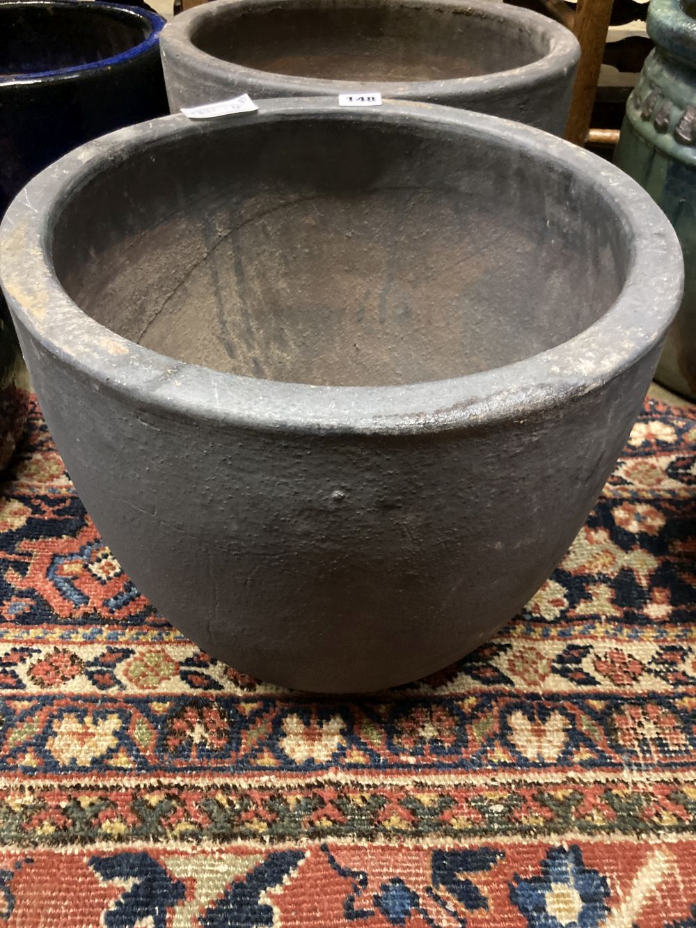 A pair of glazed earthenware garden planters, diameter 38cm